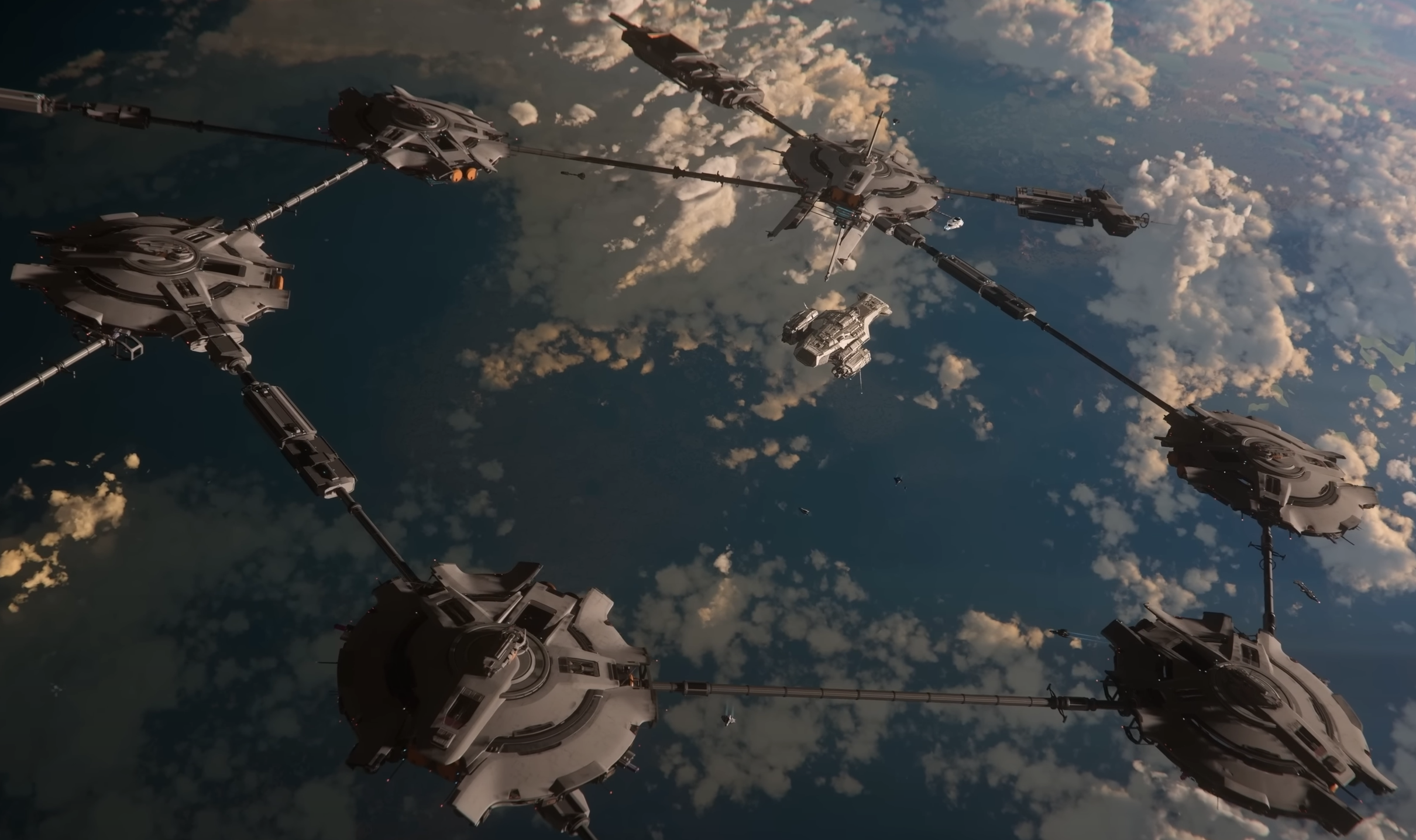 Interconnected orbital station platforms and spacecraft above a cloud-covered planet in Star Citizen